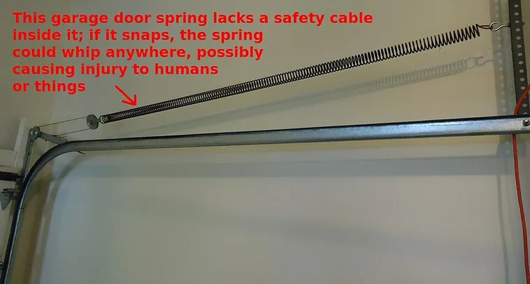 garage door cable repair detail 1 — rusty metal cable